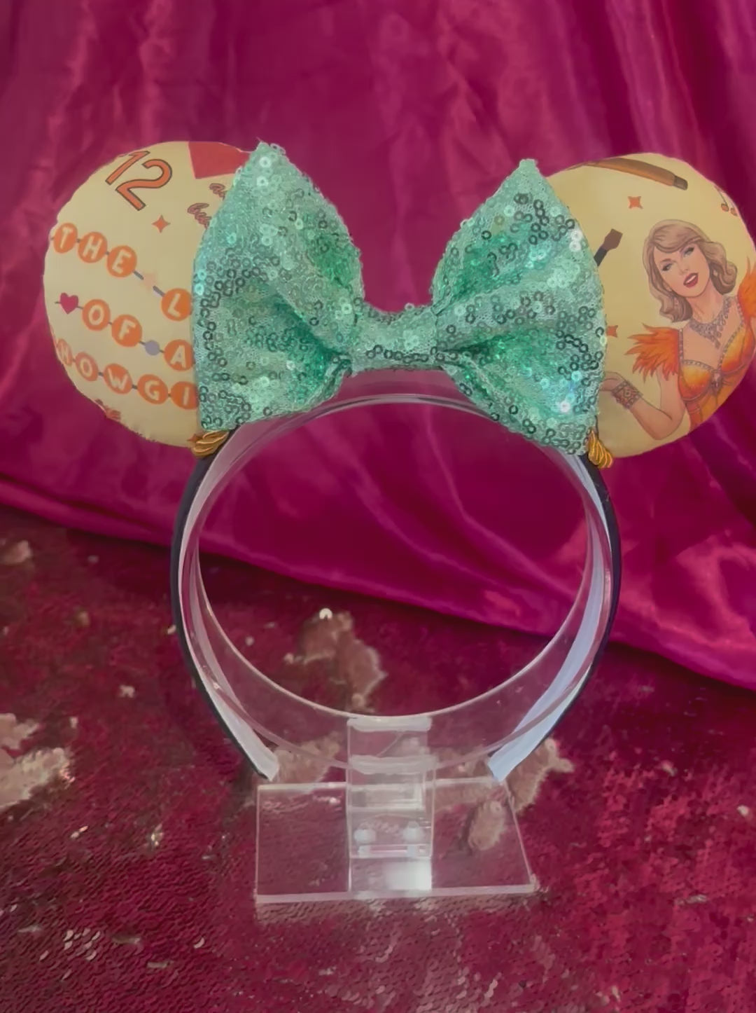 Handmade and ready to ship Ophelia Mouse ears with TS images on the ears along with TLOAS with a mint sequin bow, orange twisted trim and on a black universal sized headband. 