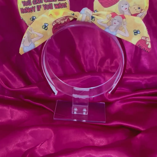 Handmade and ready to ship Twisted bow Honey Mouse ears with TS and Pooh on the fabric front and back and the bow as well. The headband has red plush fabric and is a universal sized headband.