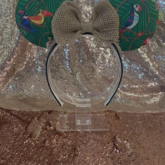 Handmade, made and ready to ship. TIKI inspired Mouse ear headband with Tiki bird on the front and back of ears with burlap bow and jute trim along the inner ears. Mouse ears are on a Universal sized black cotton poly headband.
