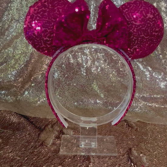 Handmade and ready to ship, Hot Pink Custom Ears. Fabric is on ears front and back with pink rhinestone trim along the inner ears and a matching hot pink sequin bow. The Headband is universal sized and has the same hot pink sequin fabric.