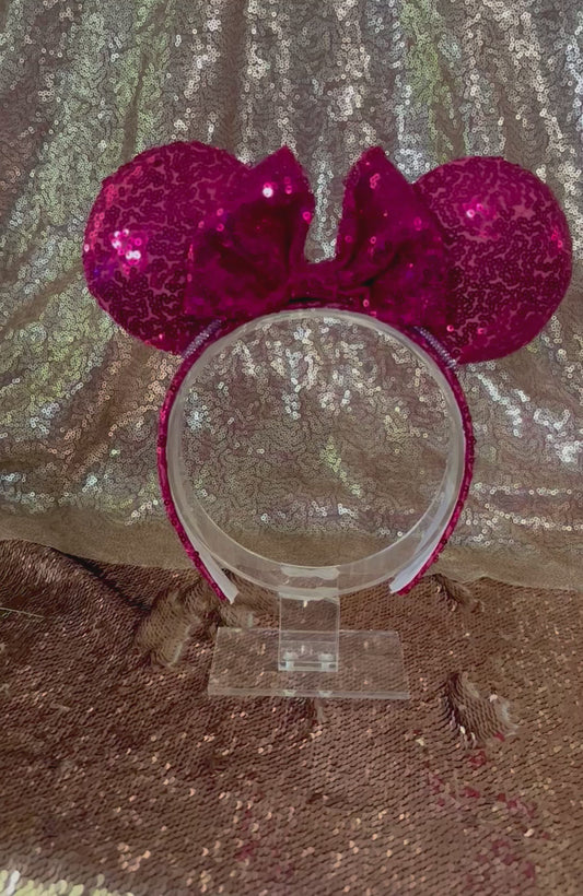 Handmade and ready to ship, Hot Pink Custom Ears. Fabric is on ears front and back with pink rhinestone trim along the inner ears and a matching hot pink sequin bow. The Headband is universal sized and has the same hot pink sequin fabric.