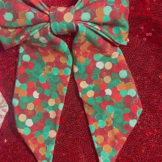 Two handmade and ready to ship French Tailed bows with barrette backings. Comes in Christmas color dots and Stocking Stuffers. Made with Cotton Lycra fabric. 