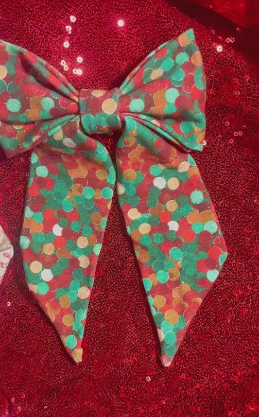 Two handmade and ready to ship French Tailed bows with barrette backings. Comes in Christmas color dots and Stocking Stuffers. Made with Cotton Lycra fabric. 