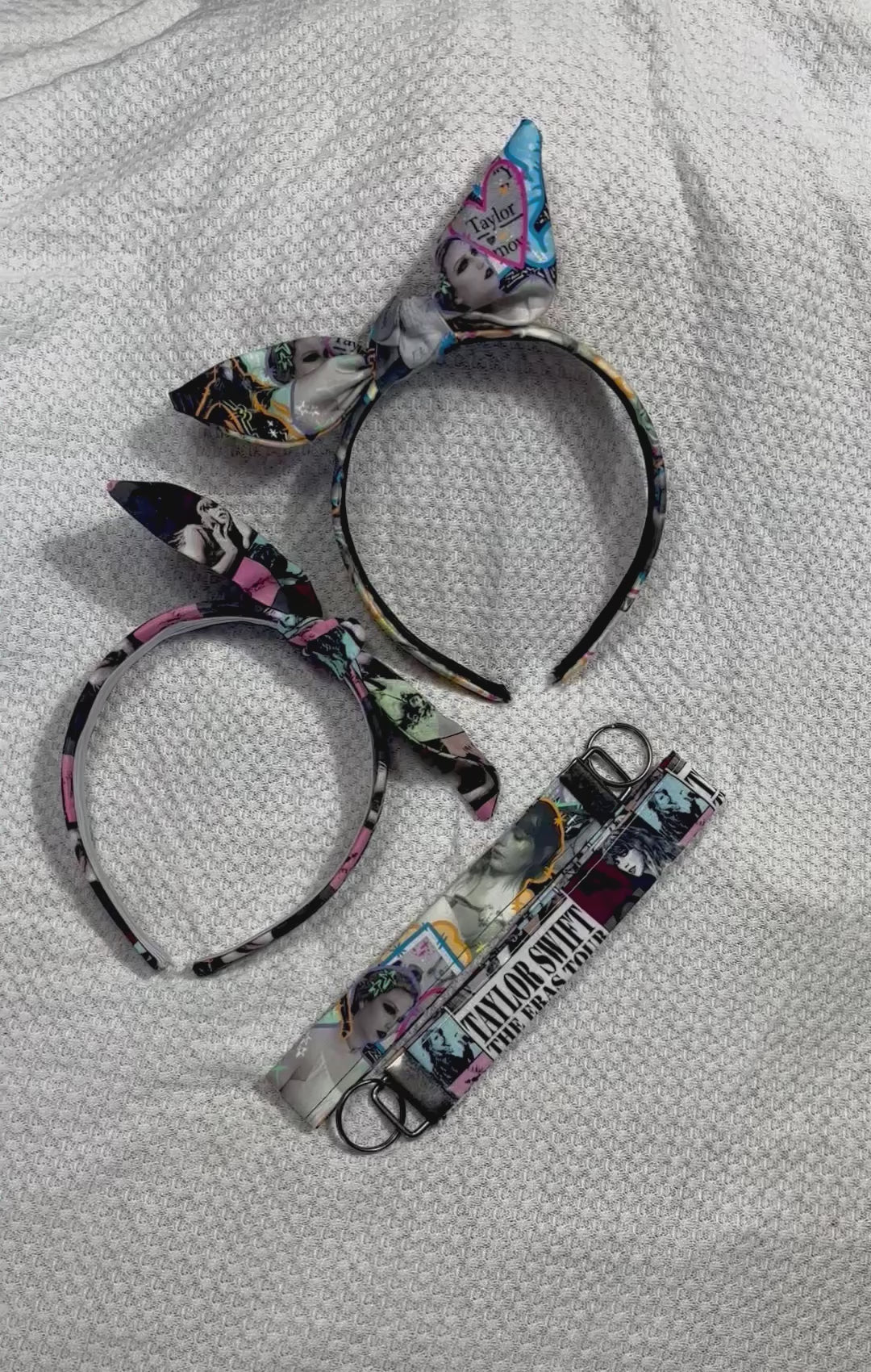 two twisted bow headbands and two keychain wristlets in the same fabrics as the headbands. One set is from THE TOUR and the other is from the fortnight video. 