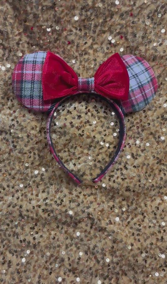 Plaid mouse ears headband with a bow on a textured gray background