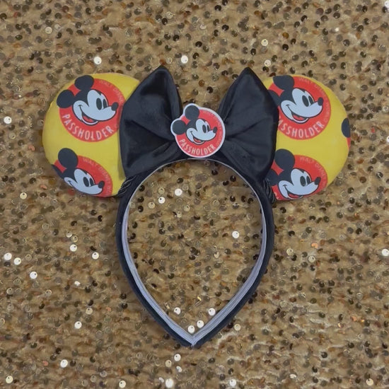 Handmade and ready to ship AP mouse ear headband. The fabric is poly cotton and has the AP logo all over the fabric front and back on a black poly cotton headband with a black velvet bow that has an AP flatback on the middle. 