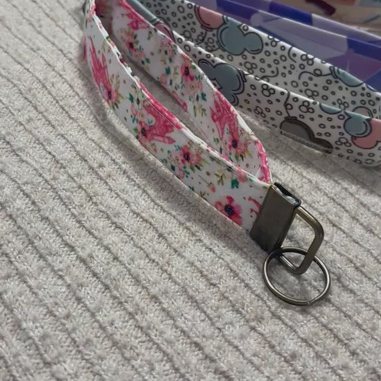 Five colorful keychain wristlets with different patterns inspired by Magic Kingdom. 
