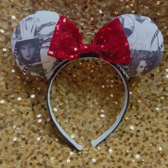 Mouse ears with a red bow on a white background