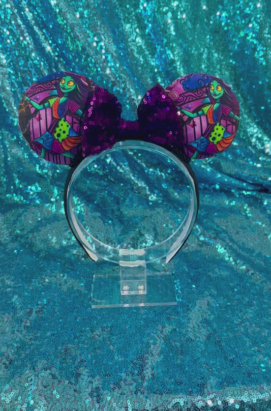 Handmade and ready to ship Sally mouse ears with the fabric on both the front and back. The headband is black universal sized and fits most. The set has a purple sequin bow with black twisted trim along the inner mouse ears. 