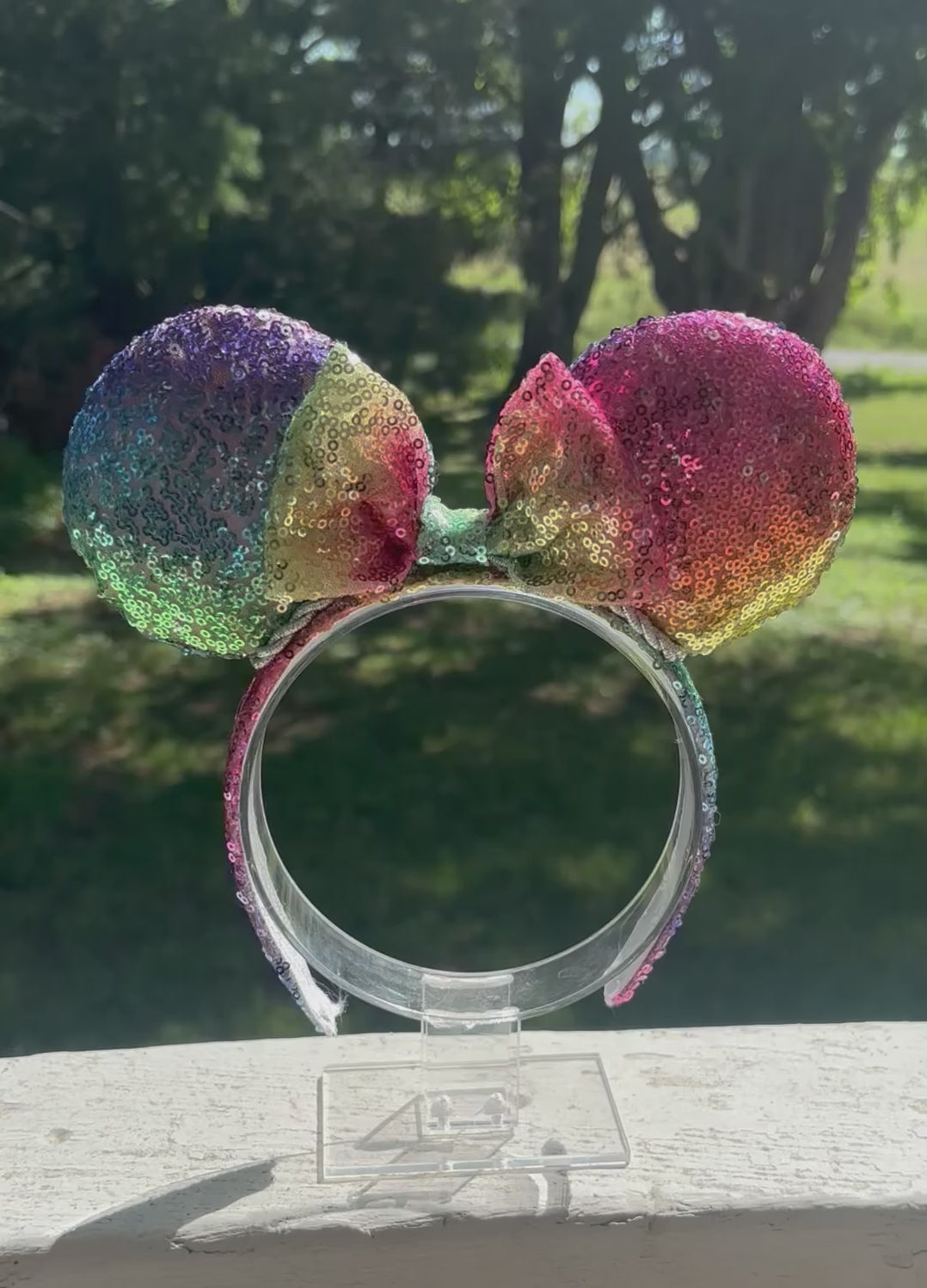Handmade and ready to ship. Mouse ears with rainbow fabric are on the front and back of mouse ears along with the headband with a matching rainbow sequin bow. 