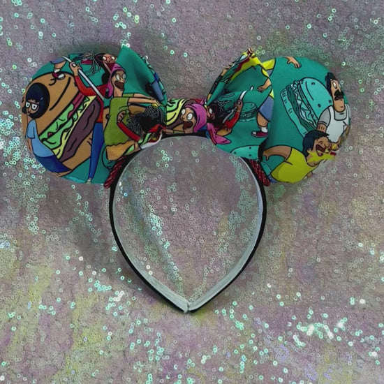 Handmade and ready to ship Burger Boss Mouse ears with the fabric on the ears, front and back and the bow. The headband is a universal sized headband and has black poly cotton fabric on it.