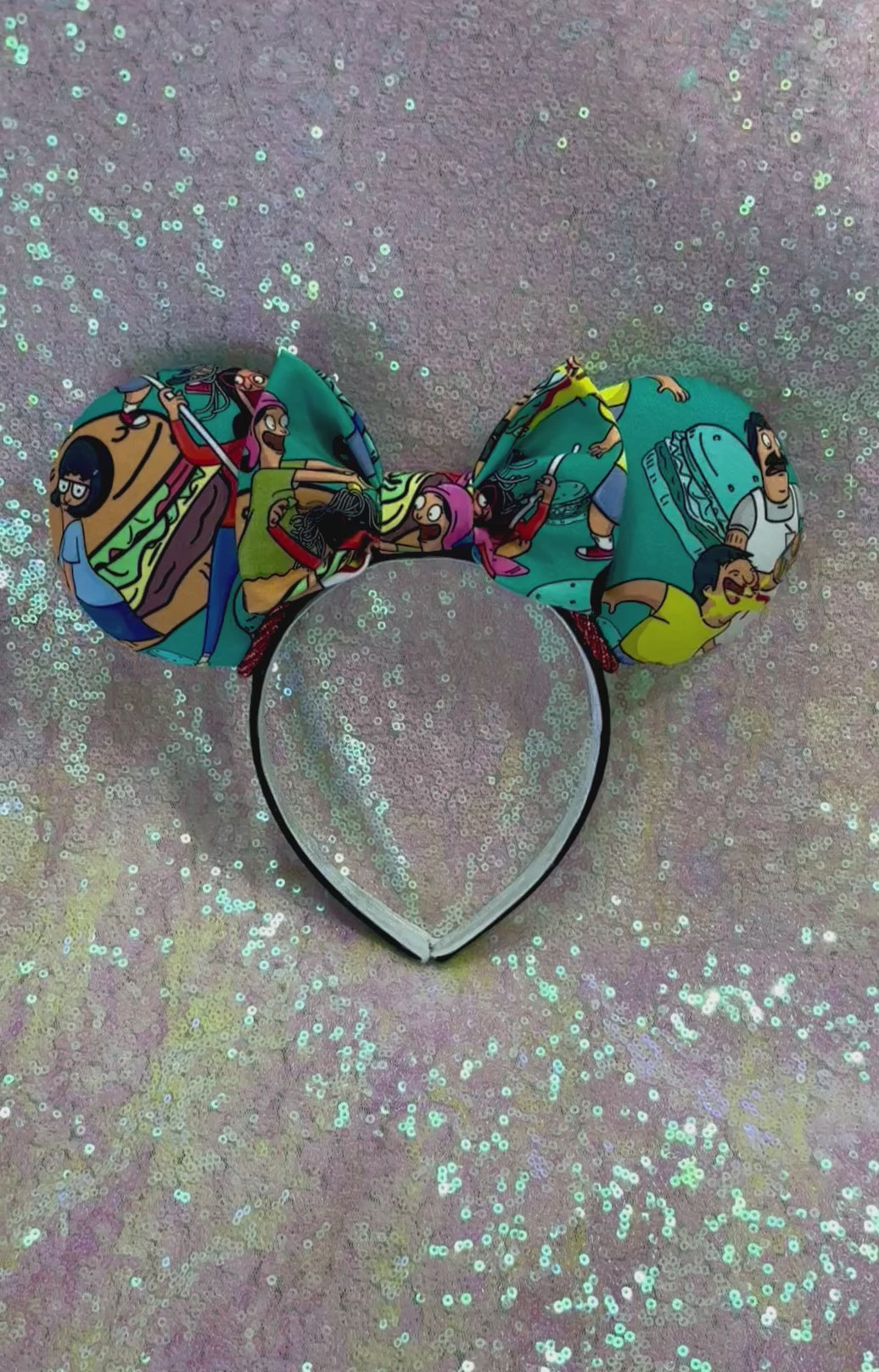 Handmade and ready to ship Burger Boss Mouse ears with the fabric on the ears, front and back and the bow. The headband is a universal sized headband and has black poly cotton fabric on it.