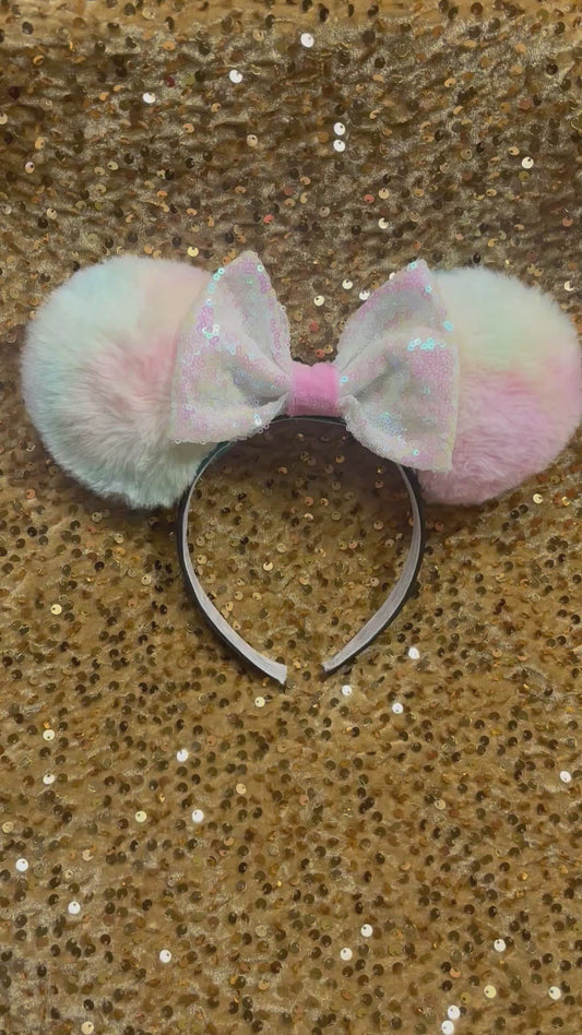 Handmade and ready to ship Fluffy Pastel-colored mouse ears with a white iridescent sequin bow 
