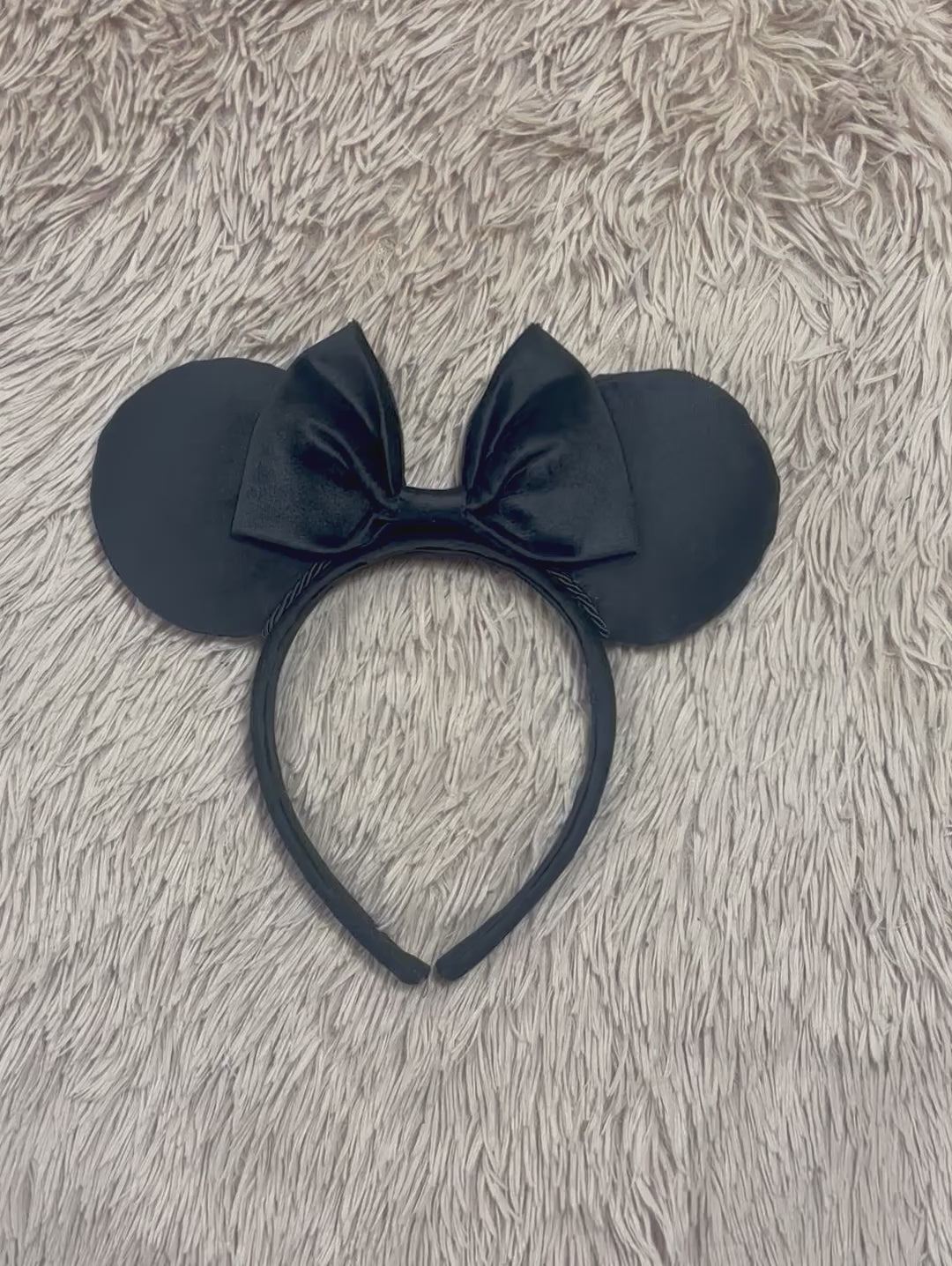 Black velvet mouse ear headband with a large matching velvet bow on a velvet universal sized headband.