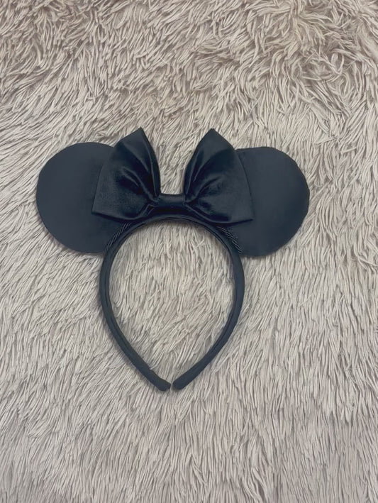 Black velvet mouse ear headband with a large matching velvet bow on a velvet universal sized headband.