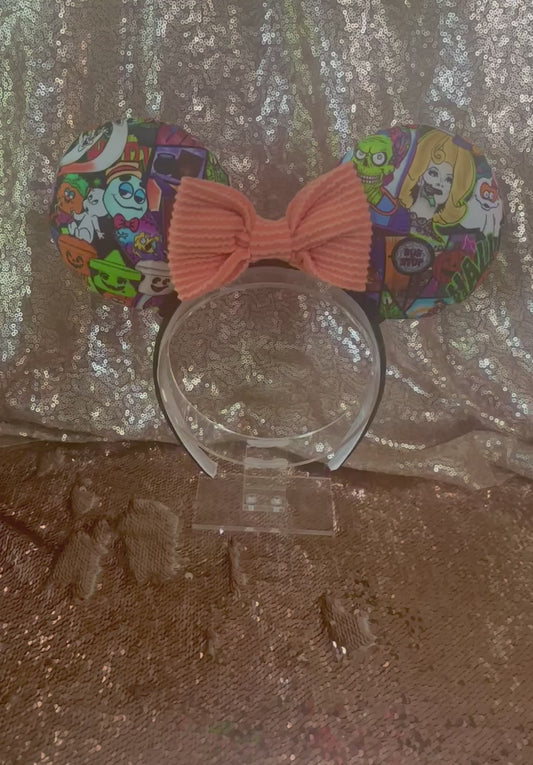 Nostalgic 90's Halloween Mouse ears with a soft orange waffle print bow with black twisted trim on a universal sized black poly cotton fabric headband. Handmade and ready to ship.