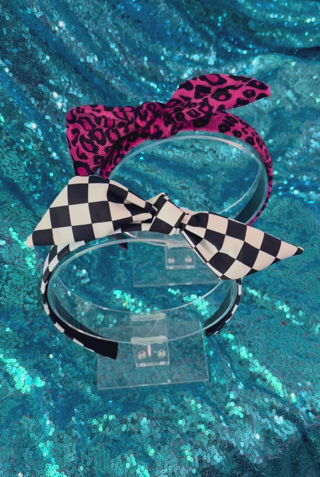 Two handmade and ready to ship headbands with twisted bow adjustable tops on a universal sized headband with elastic lining.