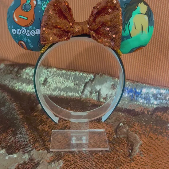 Handmade and ready to ship Actually Romantic Mouse ears with an orange sequin bow, orange twisted trim and on a black universal sized headband.