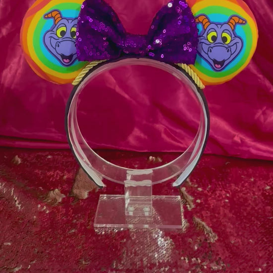 Handmade and ready to ship Figment inspired Mouse Ears with a purple sequin bow, gold trim and on a black poly cotton universal sized headband. 
