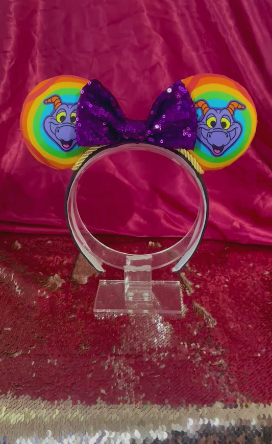 Handmade and ready to ship Figment inspired Mouse Ears with a purple sequin bow, gold trim and on a black poly cotton universal sized headband. 
