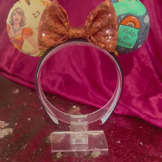 Handmade and ready to ship Wish List Mouse ears with an orange sequin bow, orange twisted trim and on a black universal sized headband. 