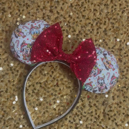 Handmade and ready to ship mouse ears. Mouse ears are on a universal sized poly cotton headband and set comes with a red sequin bow. Other colors are available if you leave a note.