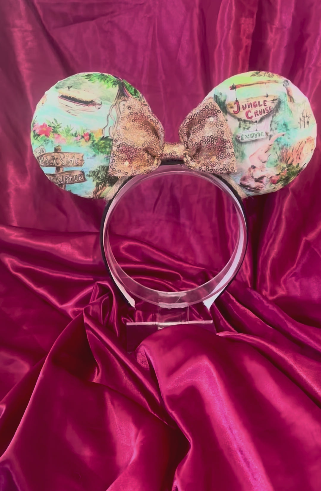 Handmade and ready to ship Jungle Cruise themed mouse ears with images from the attraction on a black headband and shown with a gold bow option.