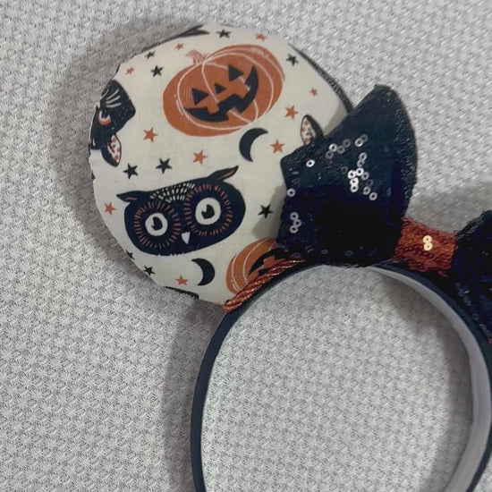 Handmade and ready to ship. Mouse ears with vintage cats, owls, and pumpkin mouse ears are on the front and back of mouse ears with a black sequin with orange middle bow.