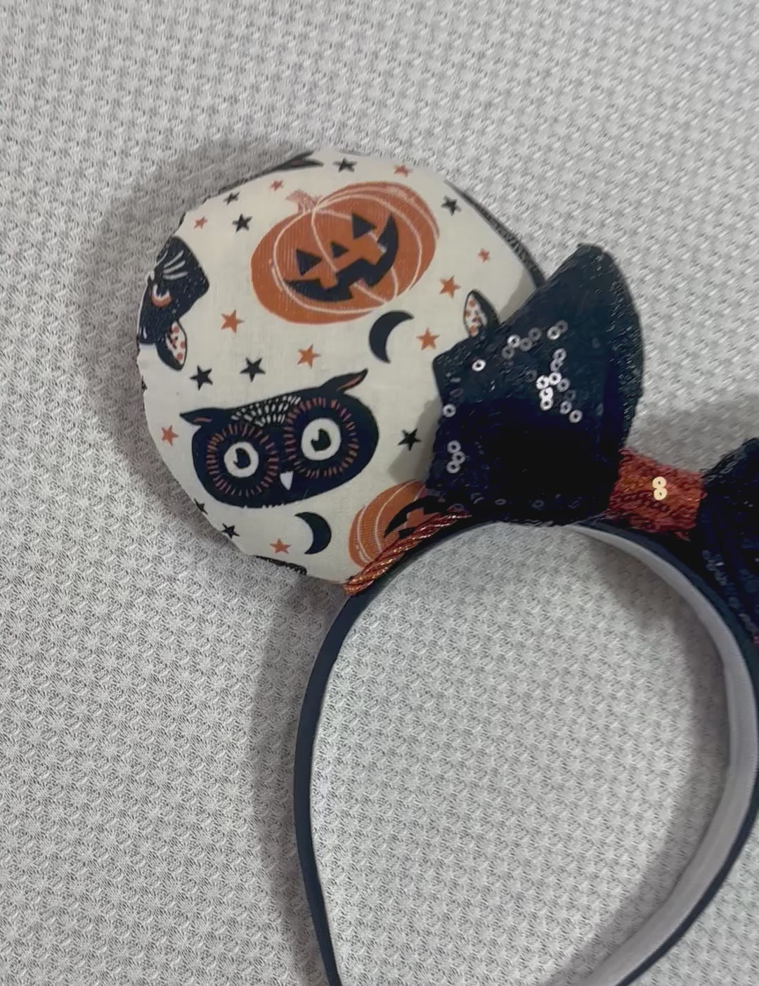 Handmade and ready to ship. Mouse ears with vintage cats, owls, and pumpkin mouse ears are on the front and back of mouse ears with a black sequin with orange middle bow.