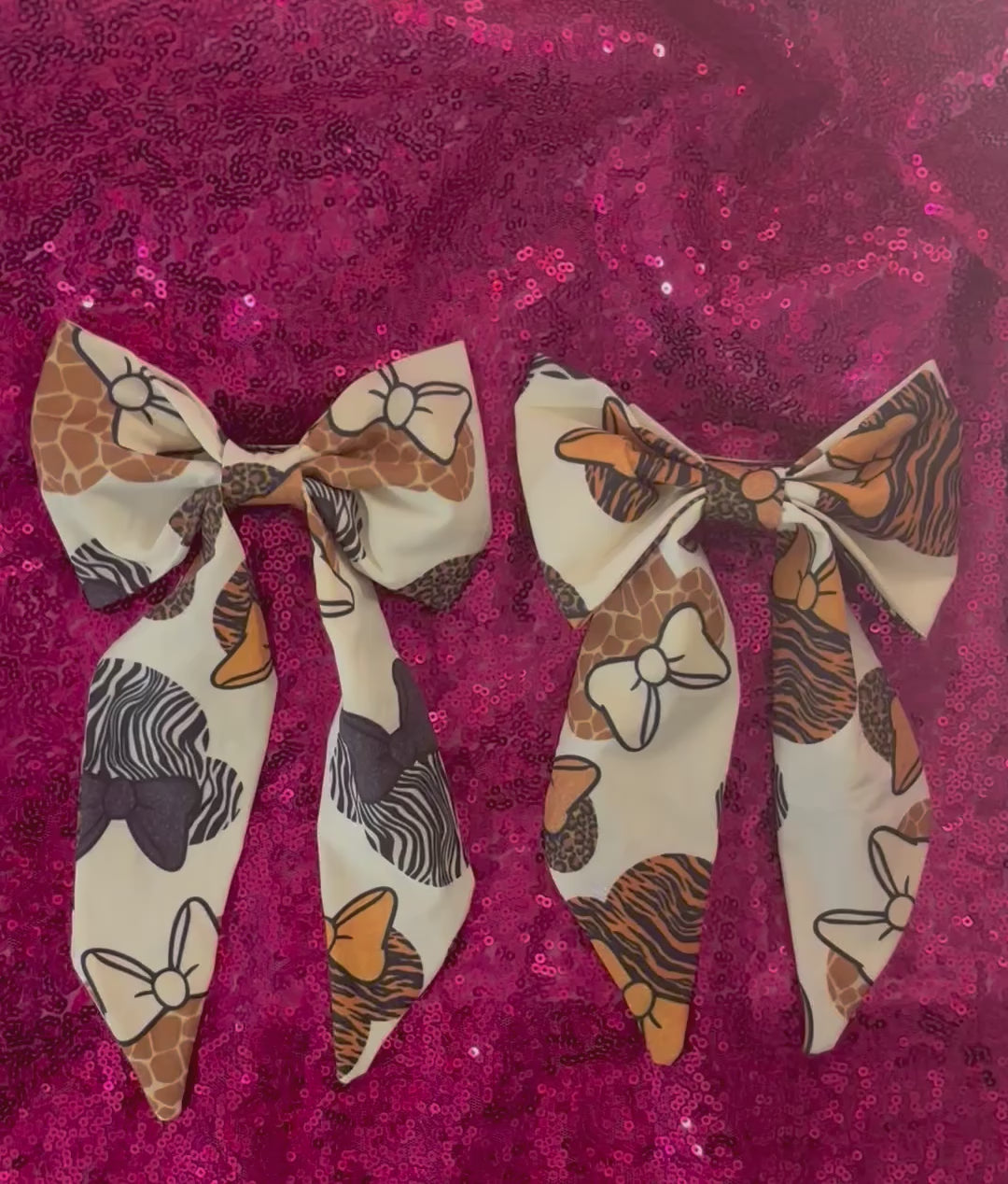 Two handmade and ready to ship fabric bows with animal print patterns in French Tailed Bows with barrette backings. 