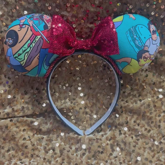 Handmade and ready to ship Burger Boss Mouse ears with the fabric on the ears, front and back and the bow is red sequins. The headband is a universal sized headband and has black poly cotton fabric on it.