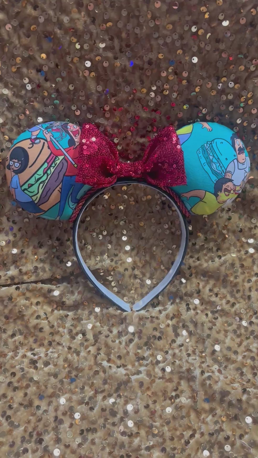 Handmade and ready to ship Burger Boss Mouse ears with the fabric on the ears, front and back and the bow is red sequins. The headband is a universal sized headband and has black poly cotton fabric on it.