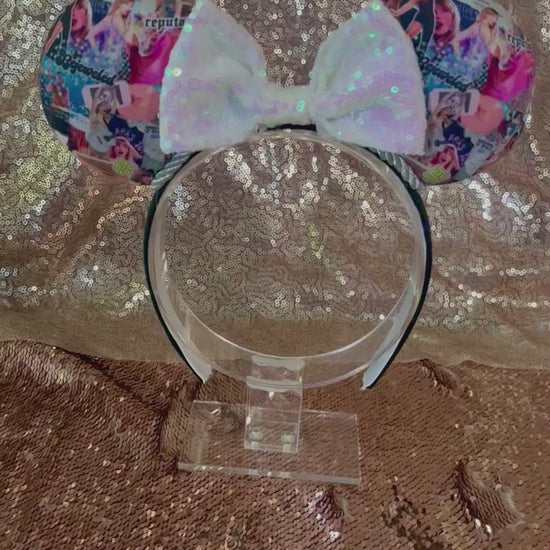 Handmade and ready to ship Bejeweled themed mouse ears with a white iridescent sequin bow. Images of TS are on fabric front and back on a universal sized poly cotton headband.