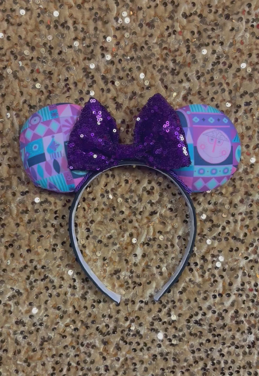 small world purple and pink mouse ear headband with a purple sequin bow
