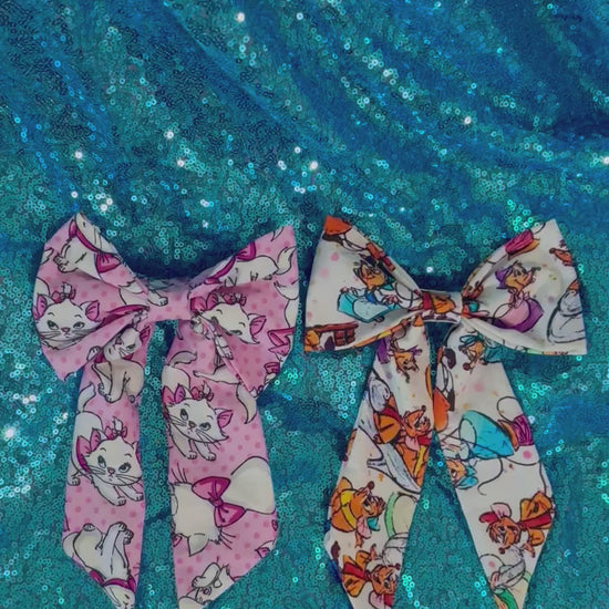 video showing both the Marie bow and the Sewing Mice bow. Made and ready to ship with free shipping.