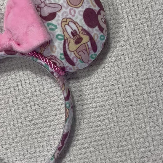 Pink and Leopard print with the fab 5 Mouse ears headband with a bow on a textured gray background