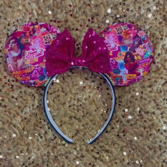Handmade and ready to ship Colorful Chappell inspired Mouse ears with a hot pink bow on a headband against a gold sequin background.