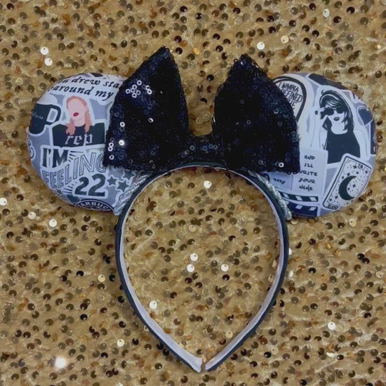 Handmade and ready to ship Mouse Ears with Black and White Swiftie sayings and pictures. has a black sequin bow.