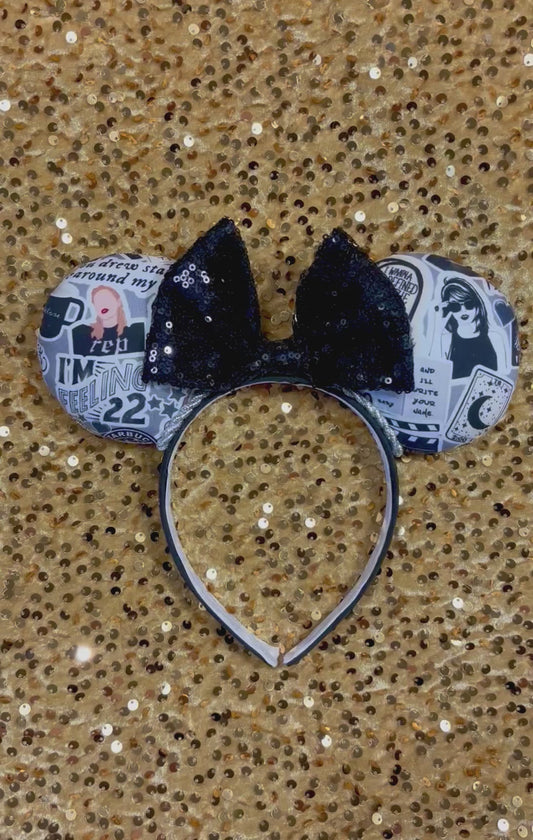 Handmade and ready to ship Mouse Ears with Black and White Swiftie sayings and pictures. has a black sequin bow.