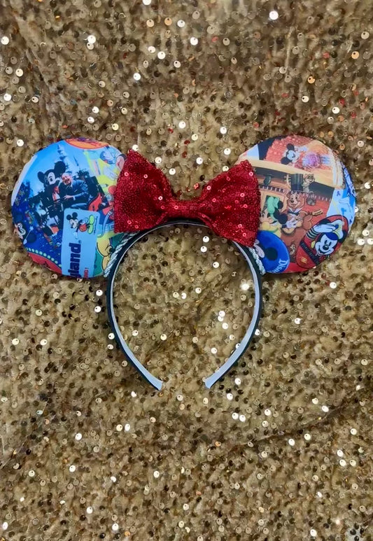Handmade and ready to ship custom and unique ears that have cartoon and park images on them on the front and back of the ears. Silver twisted trim is along the inner ears with a red sequin bow on a black poly cotton universal sized headband.