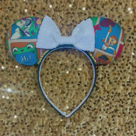 Handmade and ready to ship TS5 Inspired mouse ears. The character fabric is on the front and the back. On a universal sized black poly fabric headband. With a white sequin bow.