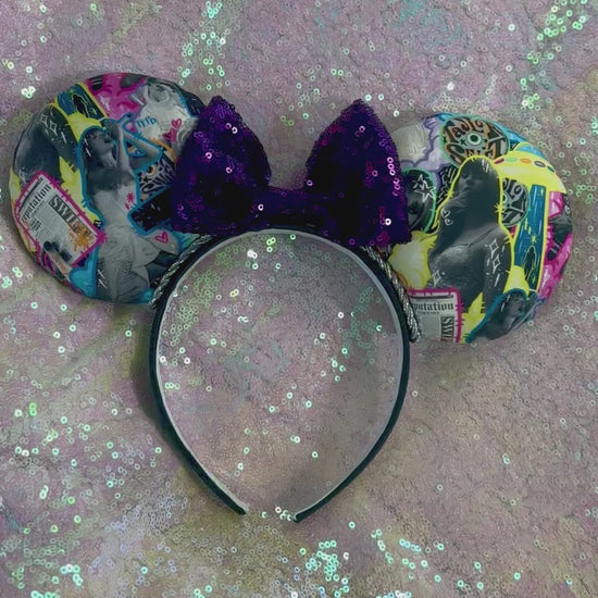 Handmade and ready to ship. Fabric images inspired by Tay and the fortnight video is on the front and back with a purple sequin bow. Shown on a white glitter background.