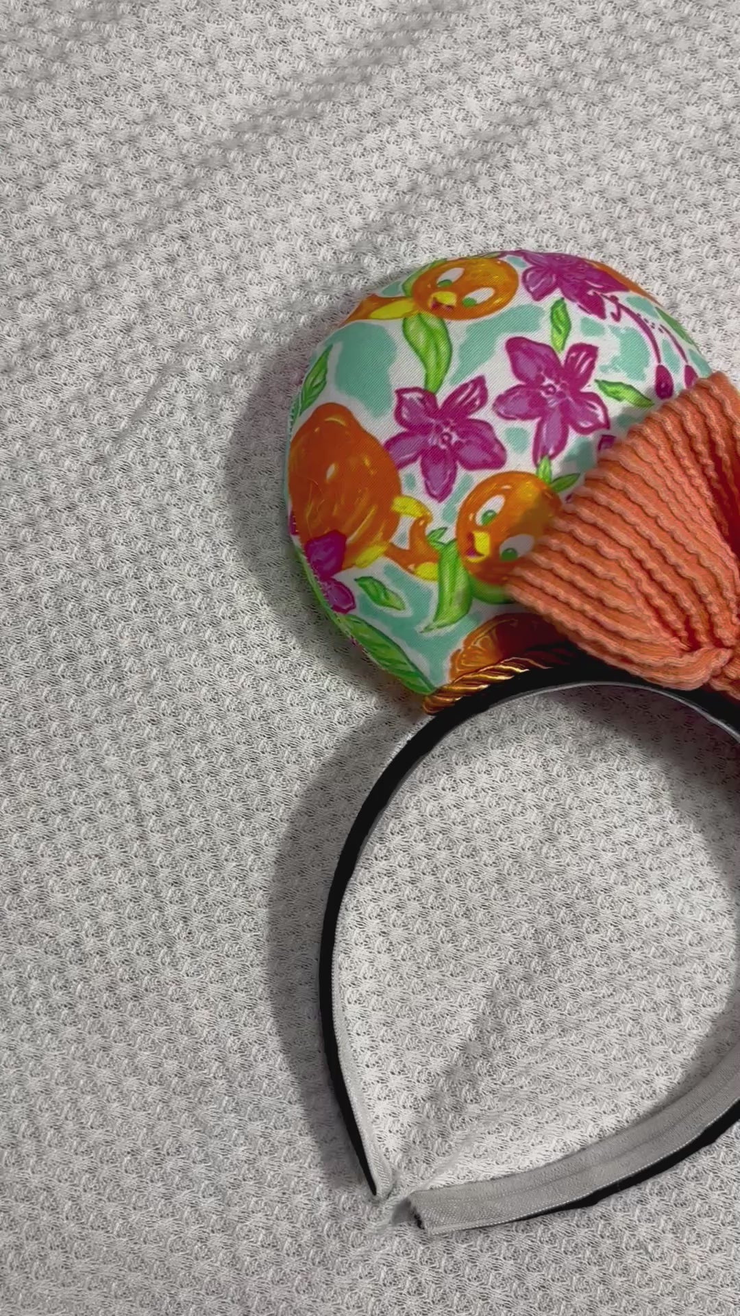 Pink, White, Blue and of course Orange on these handmade and ready to ship Orange Bird themed mouse ears with an orange waffle bow. Shown on a white background.