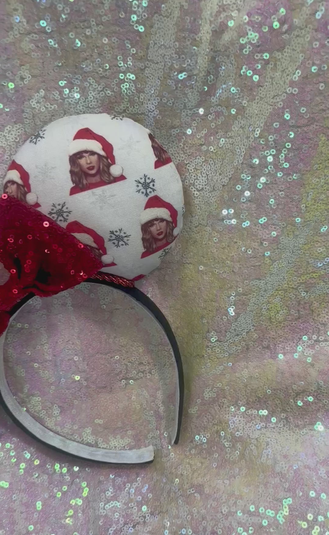 Mouse ear headband with red bow and character print on a glittery background