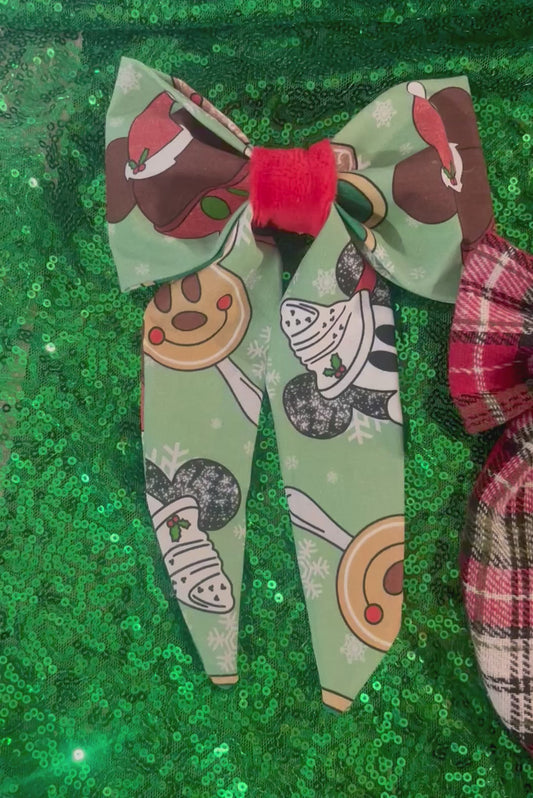 Four colorful French tailed hairbows/ one in red plaid, one in Christmas treats, one in plaid and snowflakes and one in Christmas princesses. Made and ready to ship and handmade.